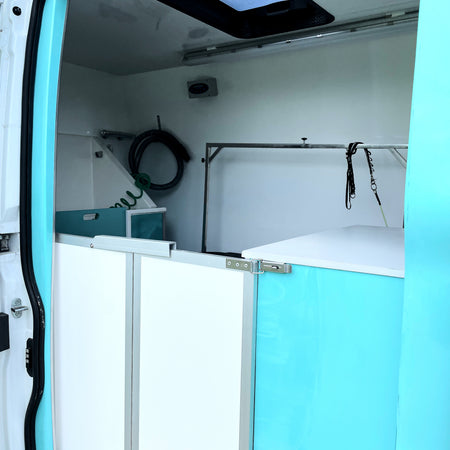 mobile dog grooming van interior with bath unit and overhead view