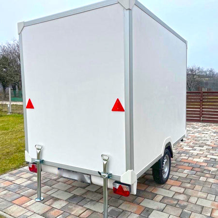 mobile dog grooming trailer rear exterior view with clean white design