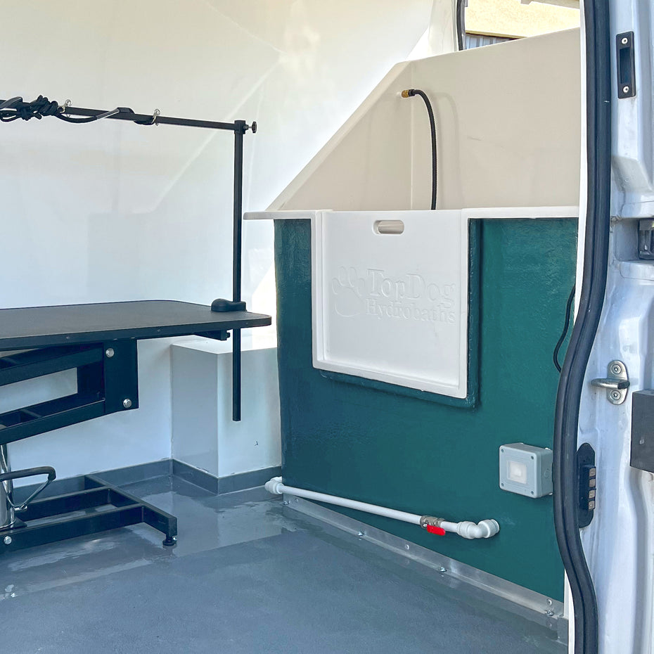 professional dog grooming van with hydrobath unit table and easy clean washable walls