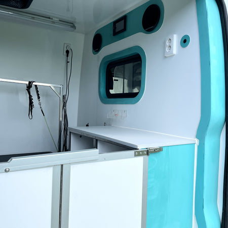 mobile dog grooming van interior with cabin window roof vent power outlet and sound system